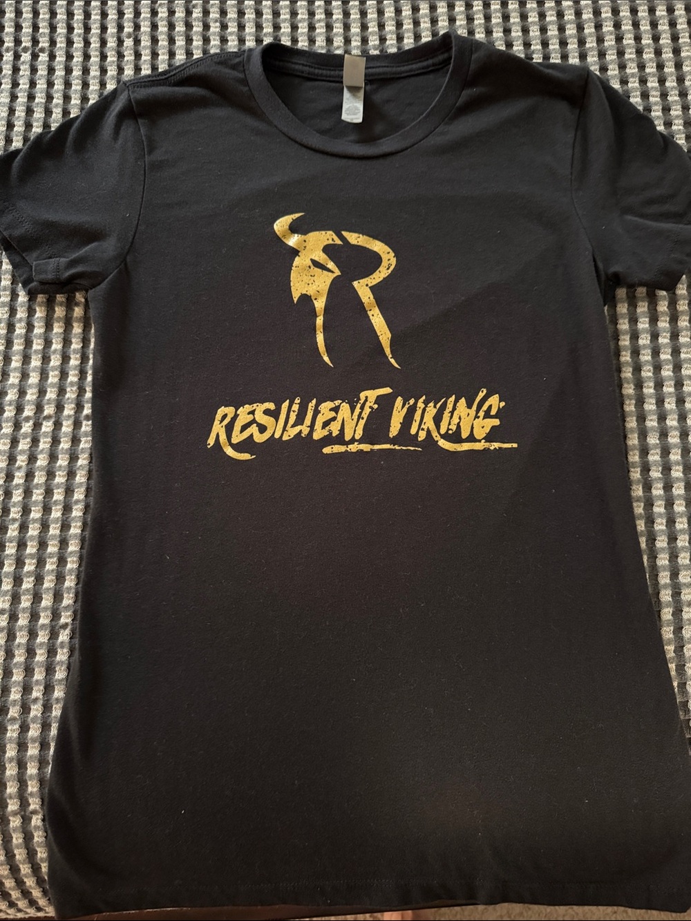 Next Level Apparel Black Short Sleeve Tee with Gold "Resilient Viking" Graphic